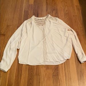 A cream long sleeve blouse